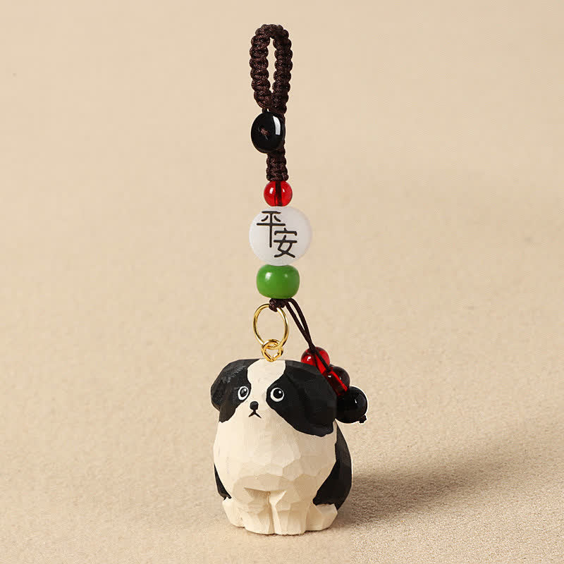 Buddha Stones Portachiavi in ​​legno intagliato con cane, Om Mani, Padme, Hum e la saggezza. - Cane sicuro bianco e nero - image 1