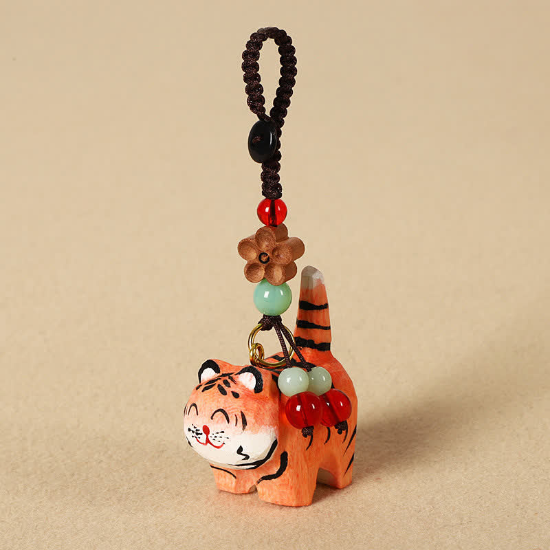 Buddha Stones Portachiavi in ​​legno intagliato con tigre, Om Mani, Padme, Hum e Focus - Tigre - image 0