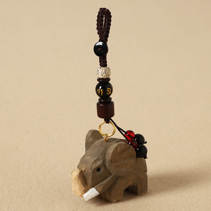 Buddha Stones Portachiavi in ​​legno naturale con elefante, simbolo di pace, Om Mani, Padme Hum e purezza. - Elefante Om Mani Padme Hum - image 0