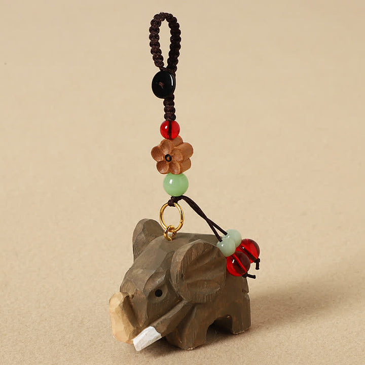 Buddha Stones Portachiavi in ​​legno naturale con elefante, simbolo di pace, Om Mani, Padme Hum e purezza. - Fiore di prugno elefante - image 1