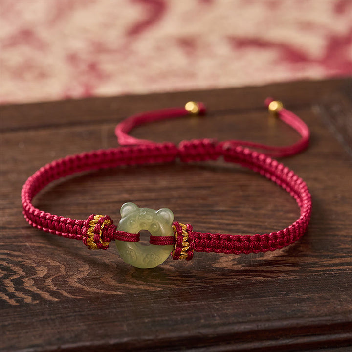 Buddha Stones Bracciale intrecciato con cordino rosso e fibbia a forma di testa di tigre in giada. - Giada naturale (il colore può variare) - 16-18 cm - image 0