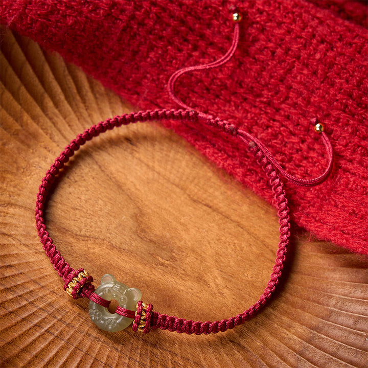 Buddha Stones Bracciale intrecciato con cordino rosso e fibbia a forma di testa di tigre in giada. - image 1