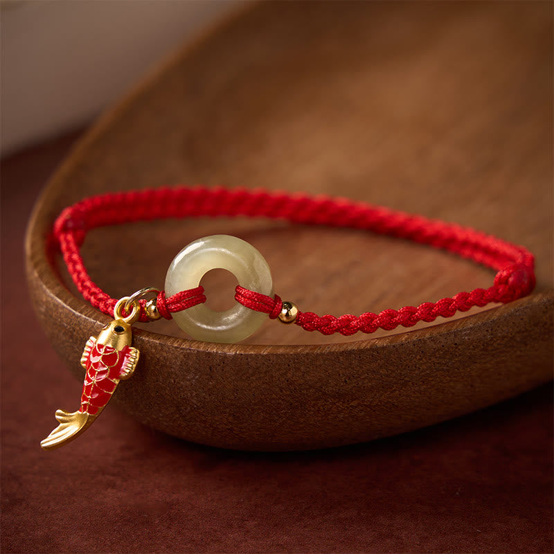 Buddha Stones Braccialetto protettivo con fibbia a forma di pesce koi, cordino rosso e giada, con ciondolo della pace. - image 1