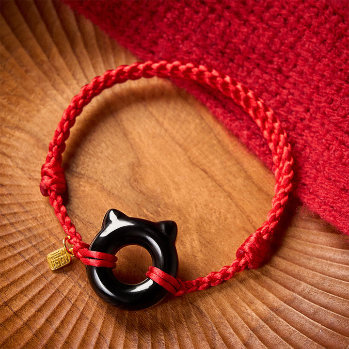 Buddha Stones Bracciale intrecciato con fibbia della pace a forma di gatto in ossidiana nera, personaggio Fu, cordino rosso di protezione. - image 1
