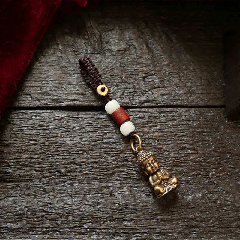 Buddha Stones Portachiavi in ​​ottone con Buddha e cinque monete dell'imperatore, cordino intrecciato, simbolo di compassione. - Cordoncino di perline bianche - image 1