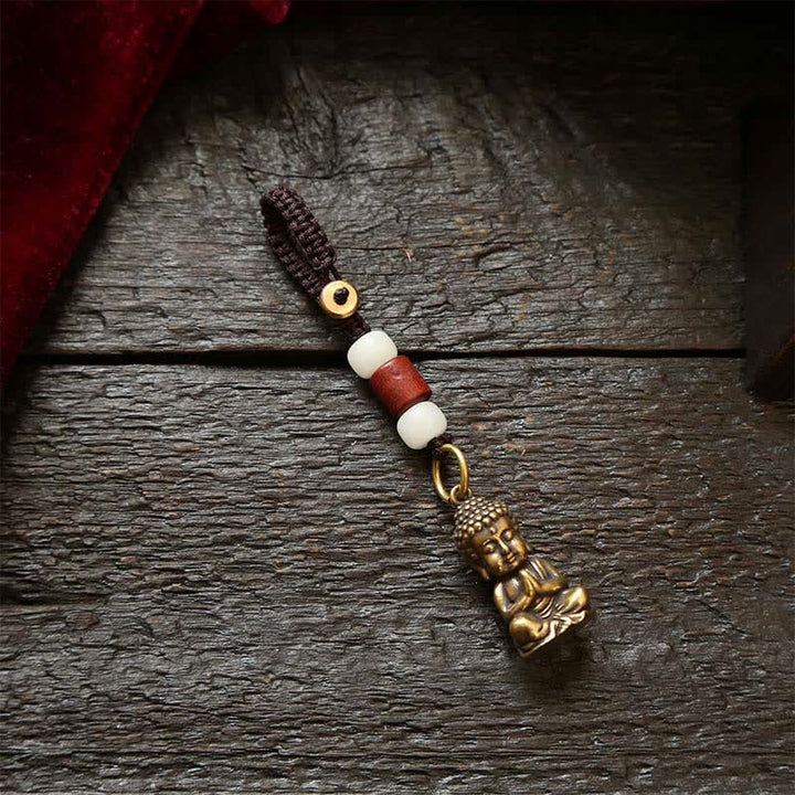 Buddha Stones Portachiavi in ​​ottone con Buddha e cinque monete dell'imperatore, cordino intrecciato, simbolo di compassione. - Cordoncino di perline bianche - image 1