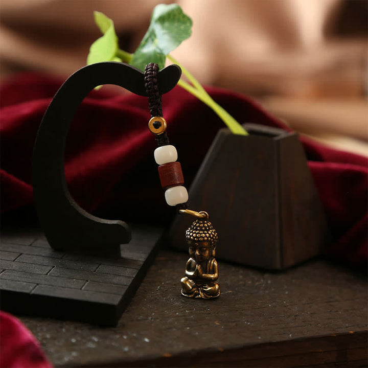 Buddha Stones Portachiavi in ​​ottone con Buddha e cinque monete dell'imperatore, cordino intrecciato, simbolo di compassione. - image 4