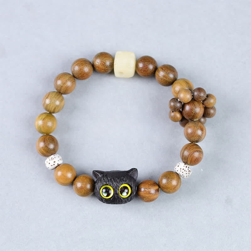 Buddha Stones Braccialetto con perline in legno d'ebano a forma di gatto portafortuna, simbolo di radicamento. - image 1