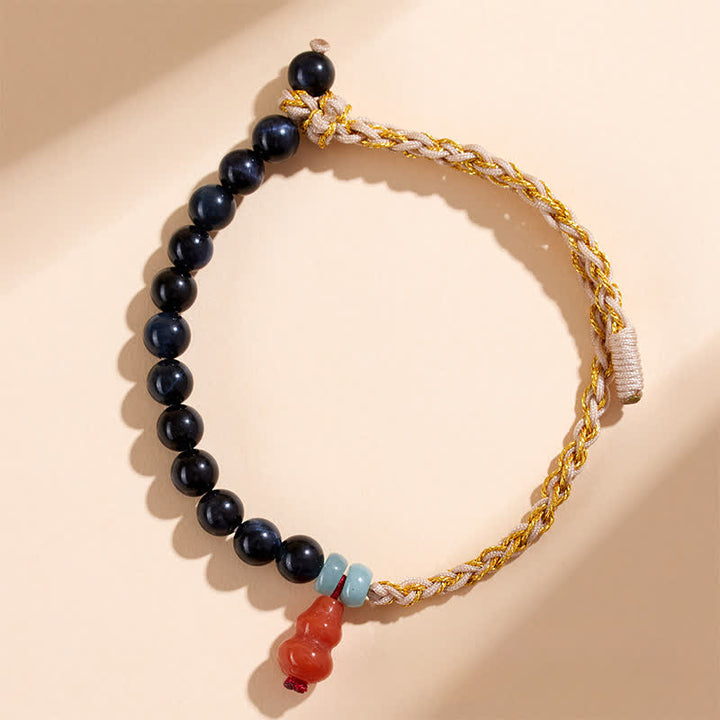 Buddha Stones Bracciale rinforzato con zucca intrecciata a mano e occhio di tigre blu. - Occhio di tigre (Protezione ♥ Equilibrio) - image 0