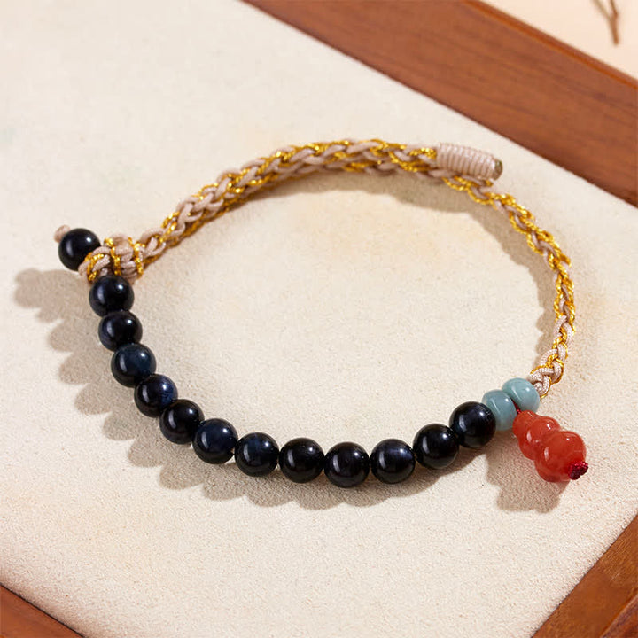 Buddha Stones Bracciale rinforzato con zucca intrecciata a mano e occhio di tigre blu. - image 2