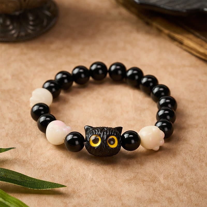 Buddha Stones Braccialetto di perline di radicamento a forma di testa di gatto occhio giallo in ossidiana nera intagliata a mano. - image 1