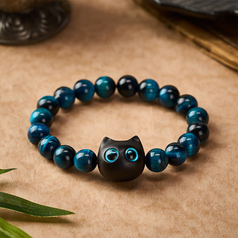 Buddha Stones Braccialetto di forza per gatti in ebano e legno con occhio di tigre blu - image 1