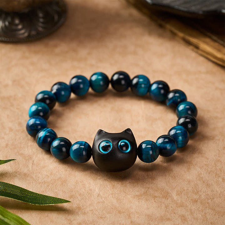 Buddha Stones Braccialetto di forza per gatti in ebano e legno con occhio di tigre blu - image 1