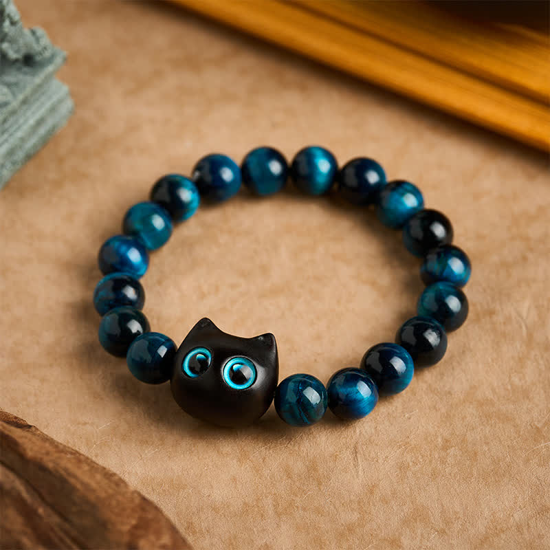 Buddha Stones Braccialetto di forza per gatti in ebano e legno con occhio di tigre blu - 10 mm (Circonferenza del polso: 6,3-6,7 pollici / 16-17 cm) - image 0