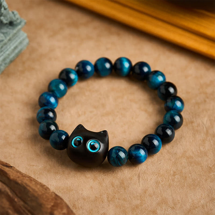 Buddha Stones Braccialetto di forza per gatti in ebano e legno con occhio di tigre blu - 10 mm (Circonferenza del polso: 6,3-6,7 pollici / 16-17 cm) - image 0