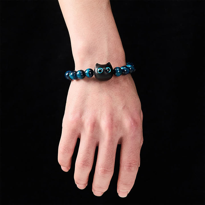 Buddha Stones Braccialetto di forza per gatti in ebano e legno con occhio di tigre blu - image 4