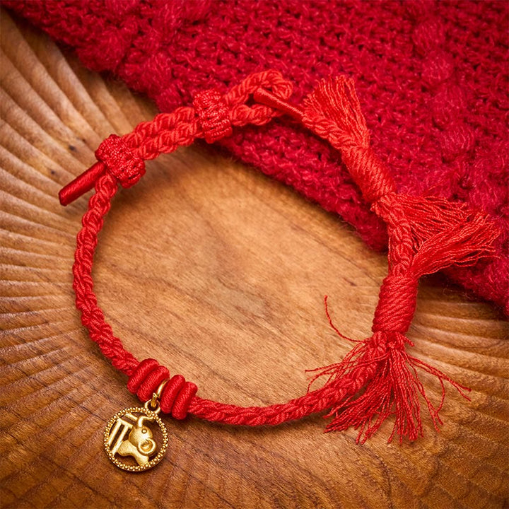Buddha Stones Bracciale tibetano con bilancia in rame placcato oro con carattere Fu dell'elefante e cordino rosso. - Rosso (circonferenza del polso 14-17 cm) - image 0