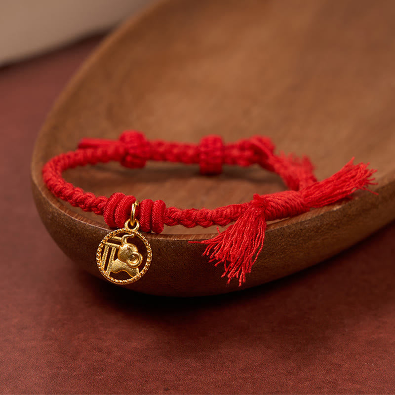 Buddha Stones Bracciale tibetano con bilancia in rame placcato oro con carattere Fu dell'elefante e cordino rosso. - image 1