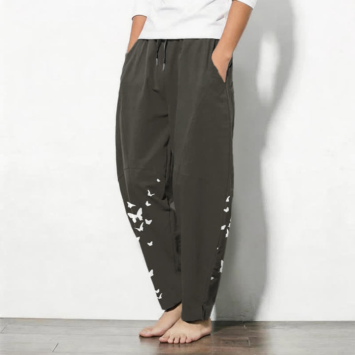 Buddha Stones Pantaloni da uomo affusolati in puro cotone bianco con motivo a farfalle e coulisse, con tasche. - image 1