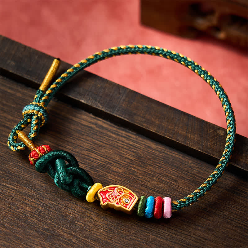 Buddha Stones Braccialetto di protezione con corda verde colorata intrecciata a mano a forma di pesce koi - image 1