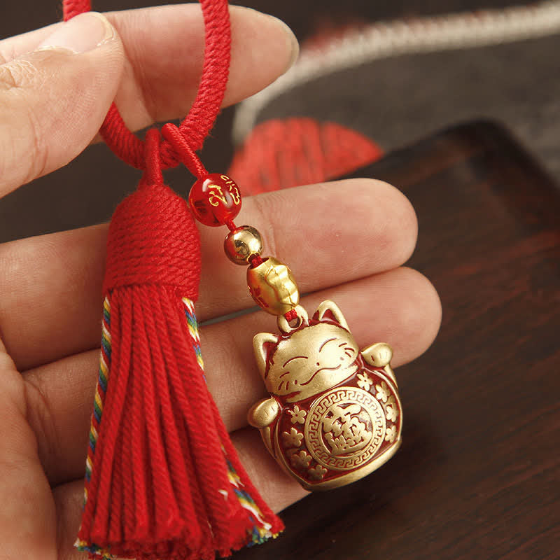 Buddha Stones Portachiavi con nappa in ottone intrecciata a mano con cordino rosso e simbolo di benedizione Fu. - Gatto portafortuna con nappa rossa - image 0