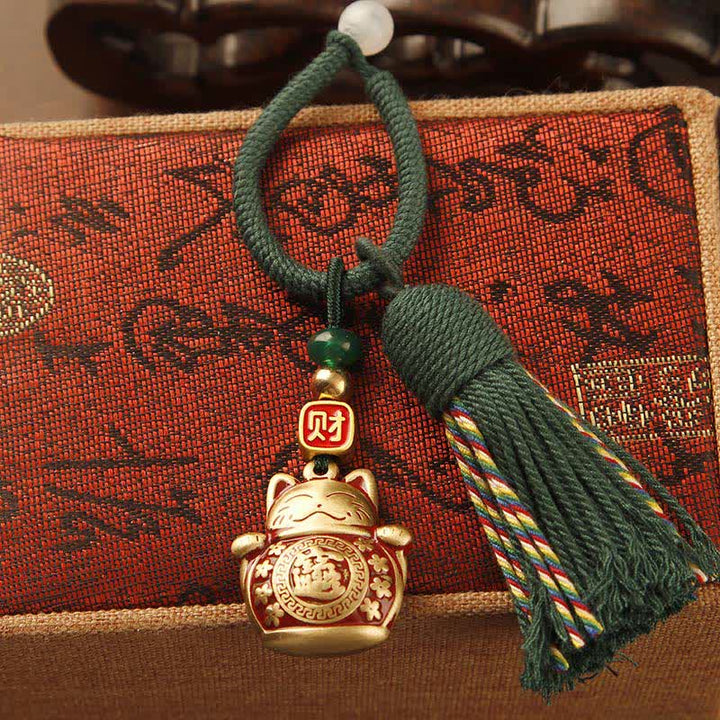 Buddha Stones Portachiavi con nappa in ottone intrecciata a mano con cordino rosso e simbolo di benedizione Fu. - Gatto portafortuna con nappa verde - image 2
