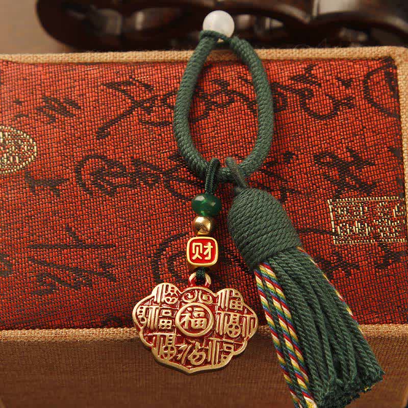 Buddha Stones Portachiavi con nappa in ottone intrecciata a mano con cordino rosso e simbolo di benedizione Fu. - Ciondolo della longevità con nappa verde - image 8