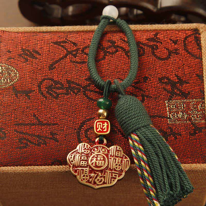 Buddha Stones Portachiavi con nappa in ottone intrecciata a mano con cordino rosso e simbolo di benedizione Fu. - Ciondolo della longevità con nappa verde - image 8