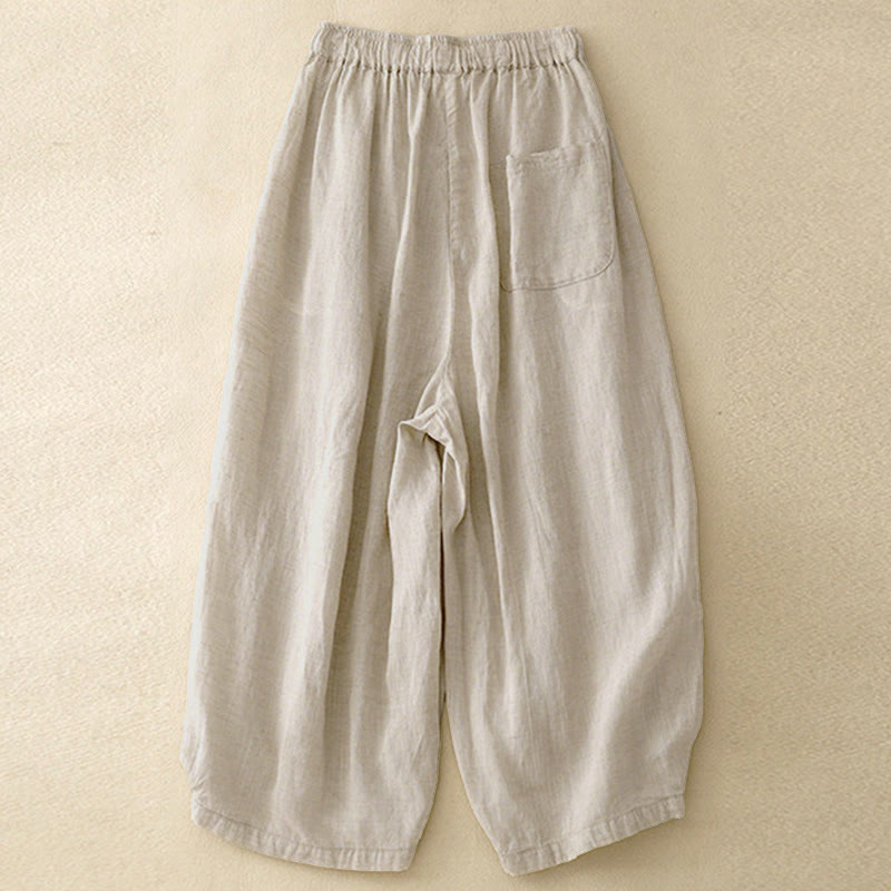 Pantaloni capri corti harem da donna con elastico in vita e tasche, modello estivo Buddha Stones. - image 1