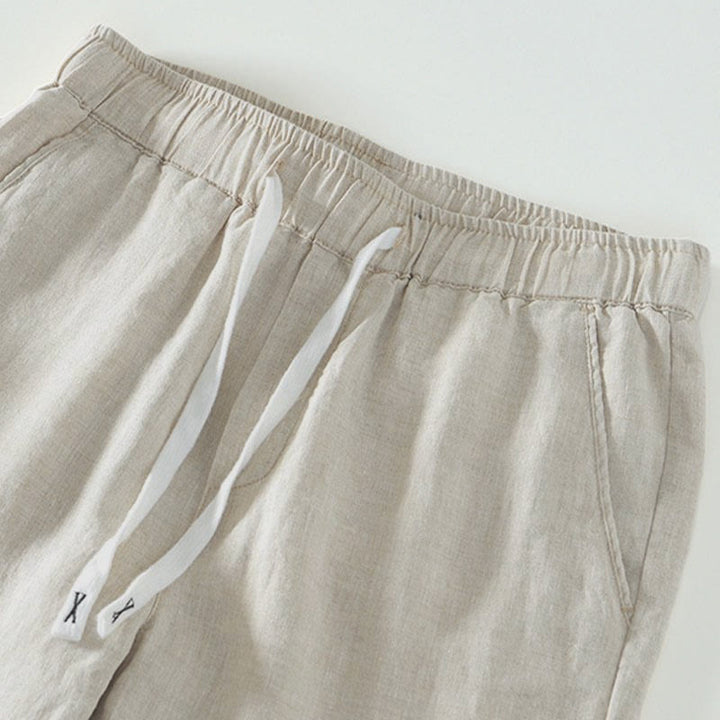 Pantaloni da uomo in lino alla caviglia con coulisse e elastico in vita, con stampa Buddha Stones Fall e tasche. - image 2