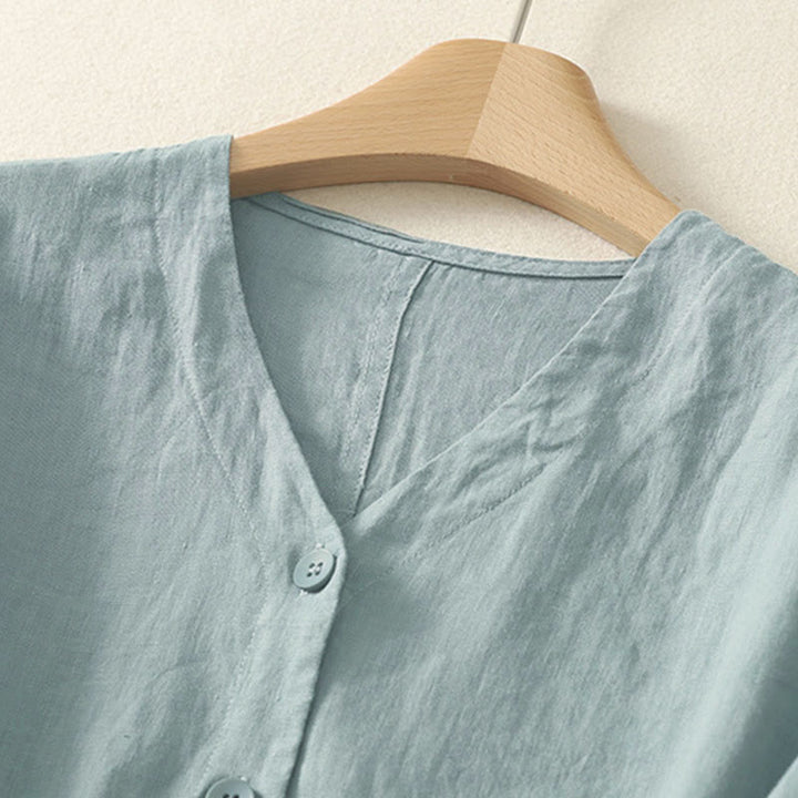 Camicia da donna a maniche corte con scollo a V e bottoni, tinta unita, con motivo Buddha Stones, ideale per l'estate. - image 1