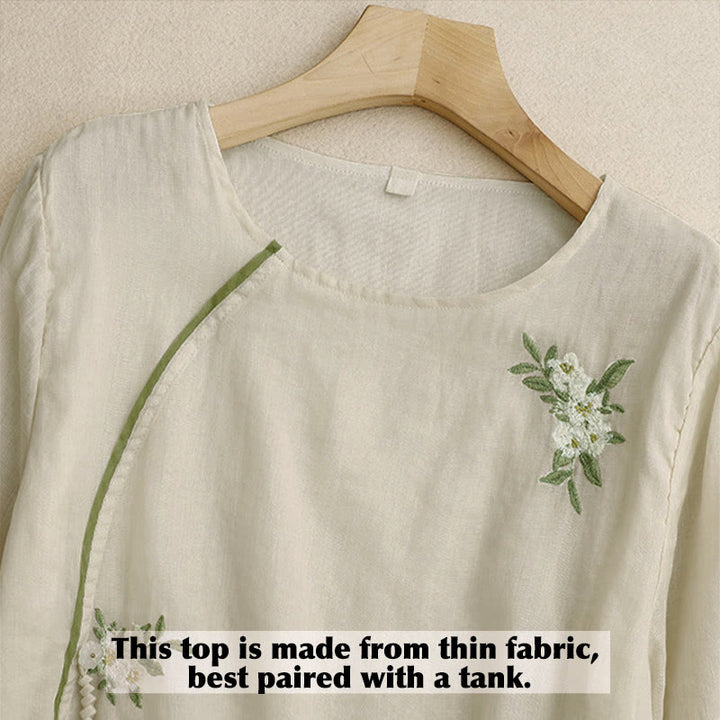 Camicia da donna a maniche a tre quarti con scollo rotondo e ricamo floreale a foglie verdi, colore beige Buddha Stones. - image 2