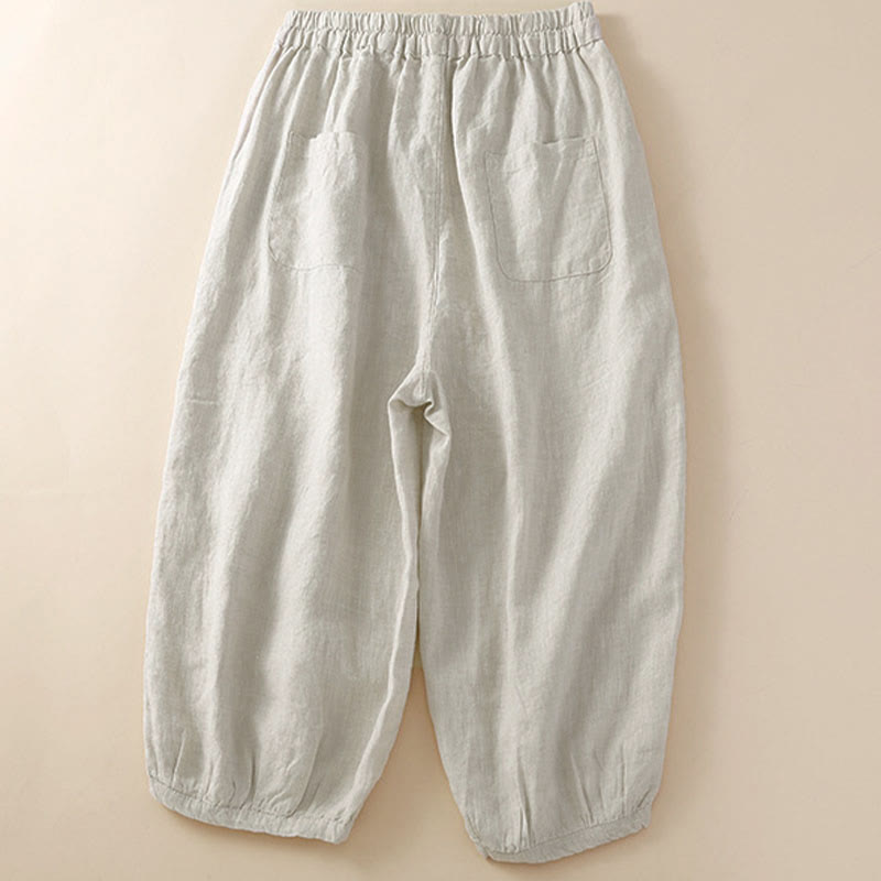 Pantaloni harem larghi con coulisse e tasche, tinta unita, con motivo floreale Buddha Stones. - image 1