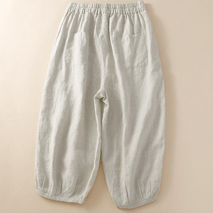 Pantaloni harem larghi con coulisse e tasche, tinta unita, con motivo floreale Buddha Stones. - image 1
