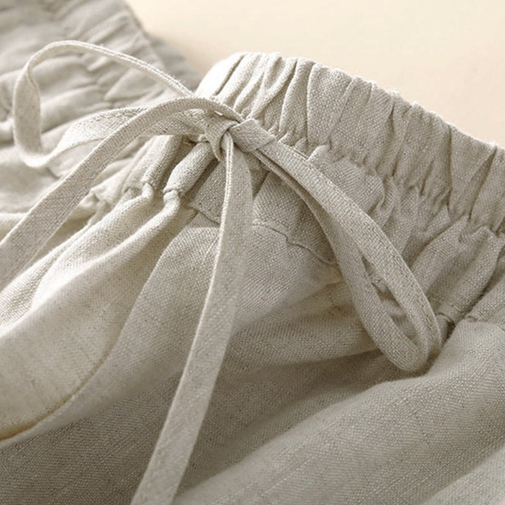 Pantaloni harem larghi con coulisse e tasche, tinta unita, con motivo floreale Buddha Stones. - image 3