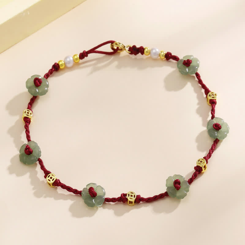 Buddha Stones Cavigliera con ciondolo floreale e cordino rosso intrecciato a mano. - image 1