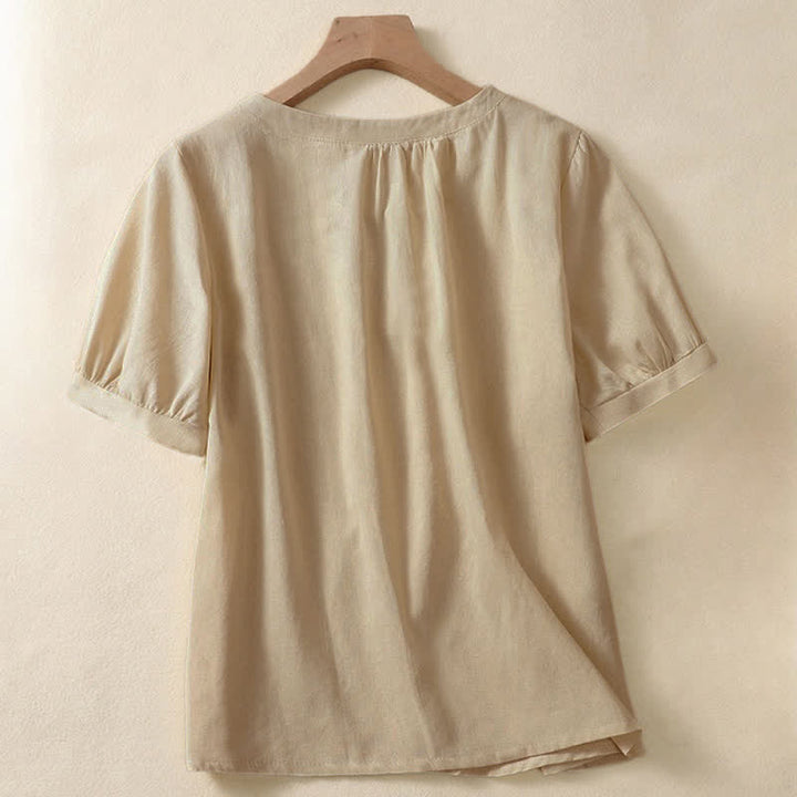Camicia da donna casual a maniche corte con scollo rotondo e bottoni, con stampa Buddha Stones. - image 1