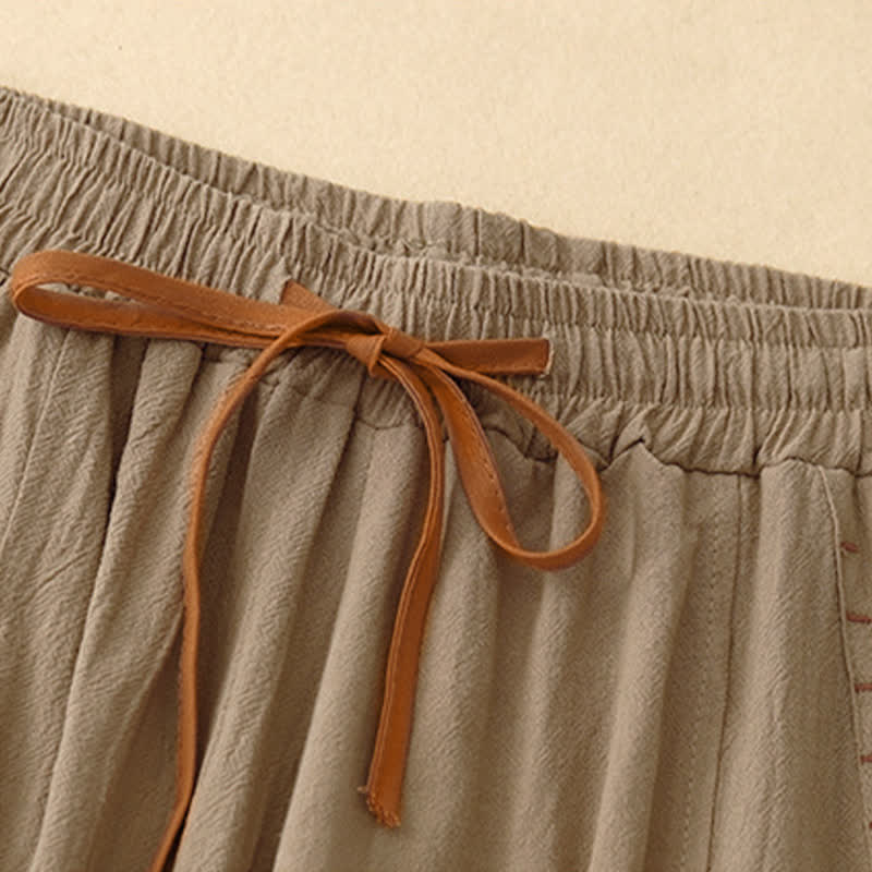 Pantaloni da donna a gamba larga con coulisse e tasche, dal design semplice e casual, con motivo Buddha Stones. - image 1