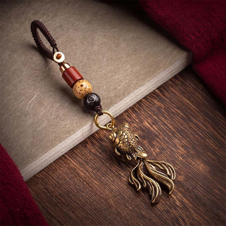 Buddha Stones Portachiavi con ciondolo a forma di carpa koi in ottone per attirare la ricchezza. - image 1