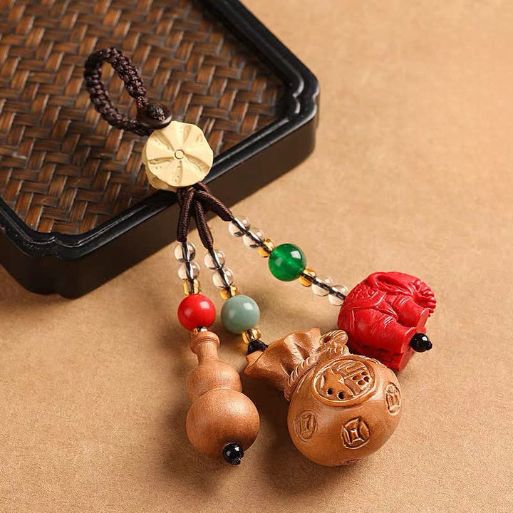 Buddha Stones Portafoglio con personaggio Fu in legno di pesca, portafortuna, elefante in cinabro, zucca di loto, portachiavi - image 1