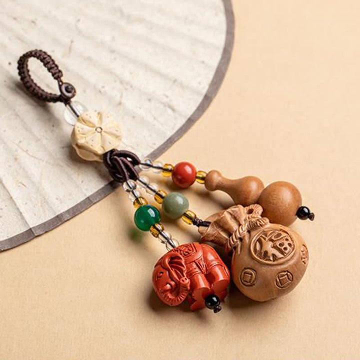 Buddha Stones Portafoglio con personaggio Fu in legno di pesca, portafortuna, elefante in cinabro, zucca di loto, portachiavi - image 19