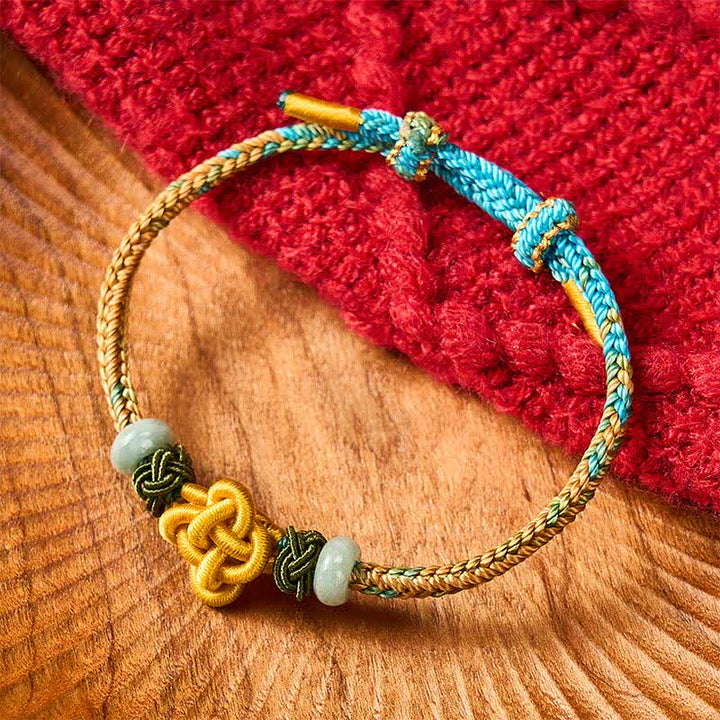 Buddha Stones Braccialetto regolabile intrecciato fatto a mano con nodo di osmanto giallo-verde e giada, portafortuna. - image 1