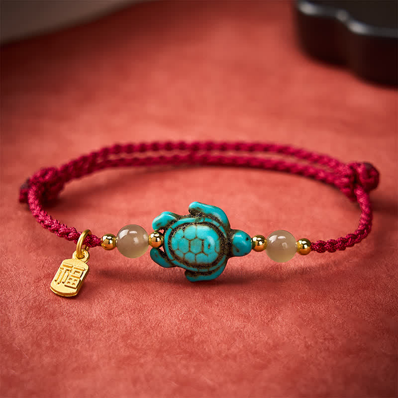 Buddha Stones Braccialetto portafortuna con perline di giada e tartaruga turchese intrecciate a mano, con personaggio Fu. - image 1