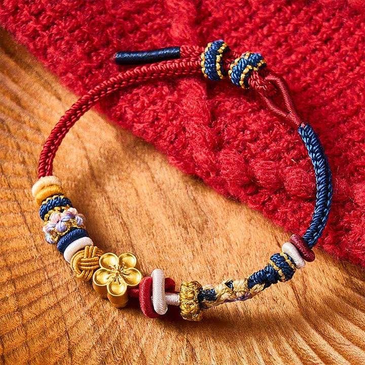 Buddha Stones Braccialetto intrecciato a mano con motivo a fiori di pesco, rosso e blu navy. - image 1