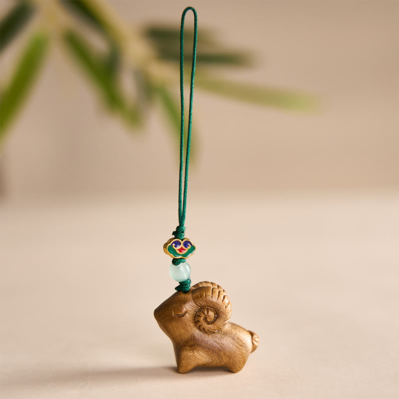 Buddha Stones Portachiavi in ​​legno di sandalo intagliati a mano con immagine positiva di una capra - Verde - image 0