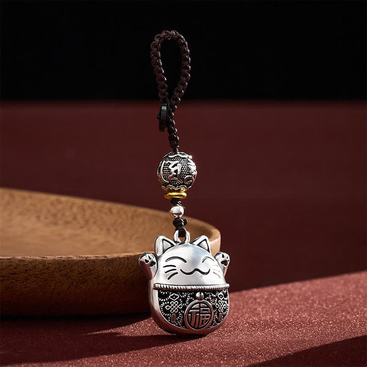 Buddha Stones Portachiavi intrecciati con personaggio Fu in rame inciso e gatto portafortuna. - image 1