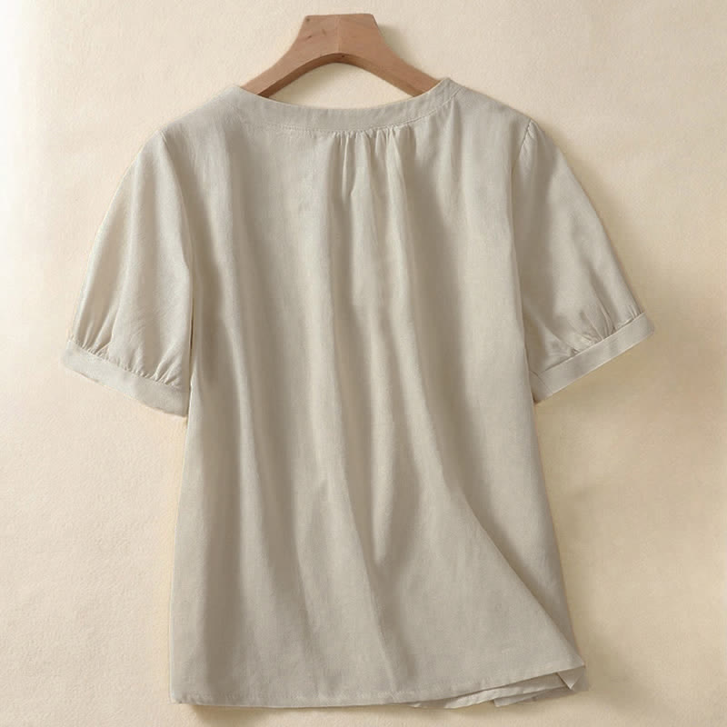 Camicia da donna casual a maniche corte con scollo rotondo e bottoni, con stampa Buddha Stones. - image 1