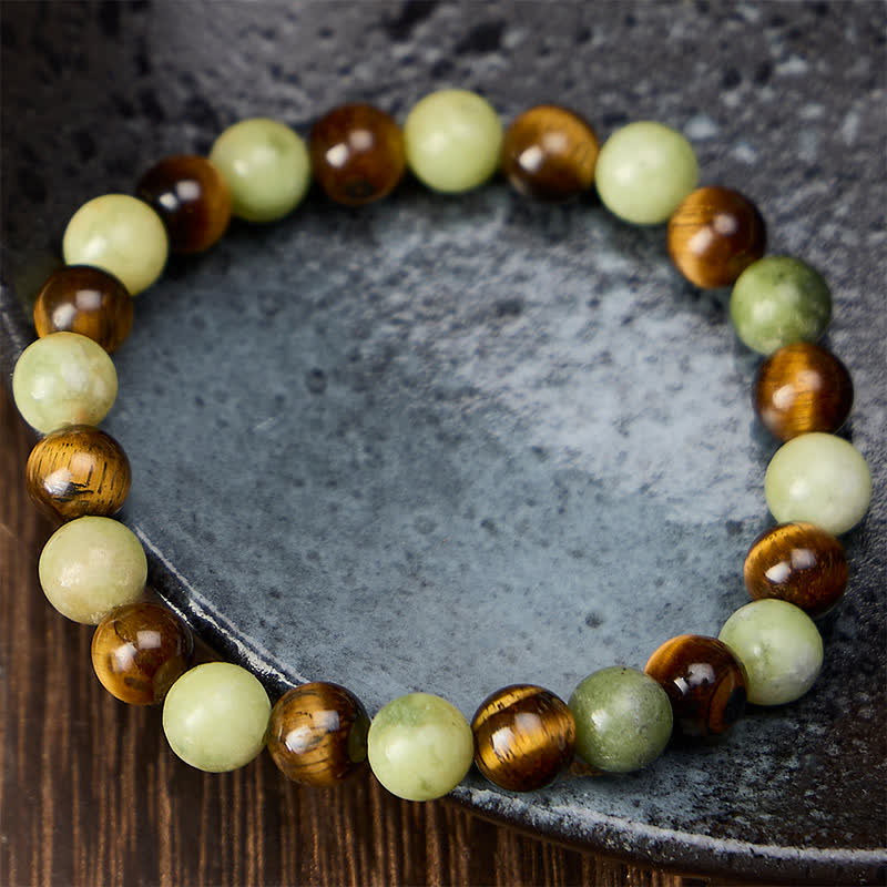 Buddha Stones Bracciale con perline rotonde in giada occhio di tigre, simbolo di forza e resistenza. - image 1