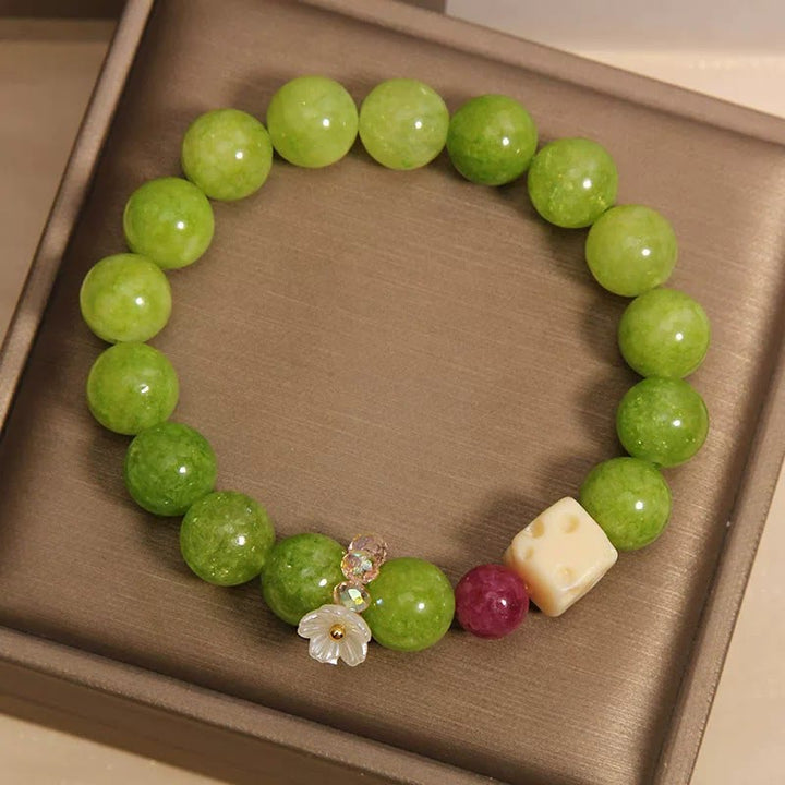 Buddha Stones Braccialetto curativo con ciondolo a forma di fiore di peridoto e perline - image 4