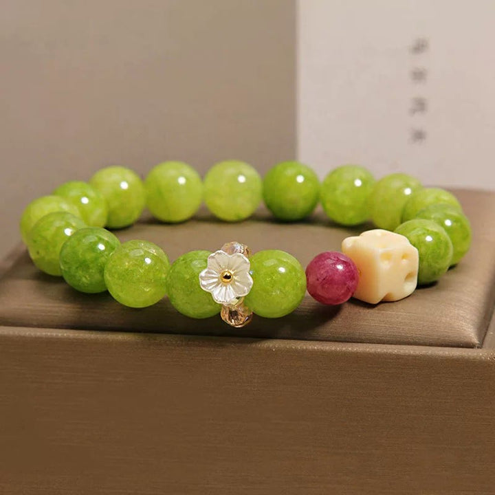 Buddha Stones Braccialetto curativo con ciondolo a forma di fiore di peridoto e perline - image 8